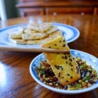 Dipping Pan-fried Tofu in Sauce