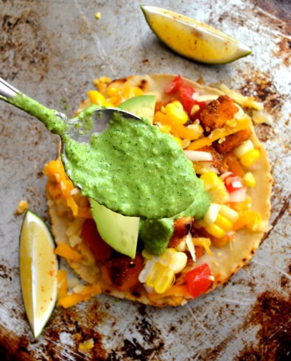 Spooning green sauce over tofu tacos by bmeteor.aiodimecu.cf