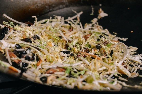 Stir-frying shredded cabbage, mushrooms, and lily flowers for moo shu by bmeteor.aiodimecu.cf