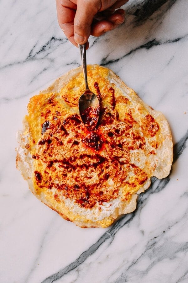 spreading sauce on Jidan Bing: The Chinese Breakfast of Champions, by bmeteor.aiodimecu.cf