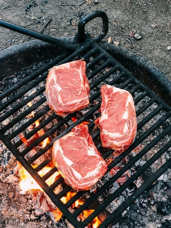 Grilling steak on a fire ring in campground, bmeteor.aiodimecu.cf