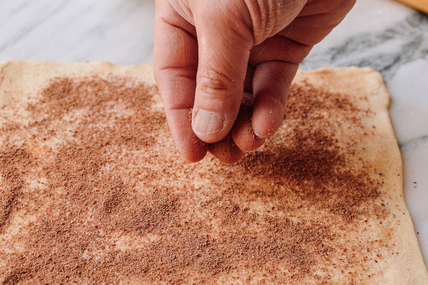 Spreading grated chocolate over puff pastry, bmeteor.aiodimecu.cf
