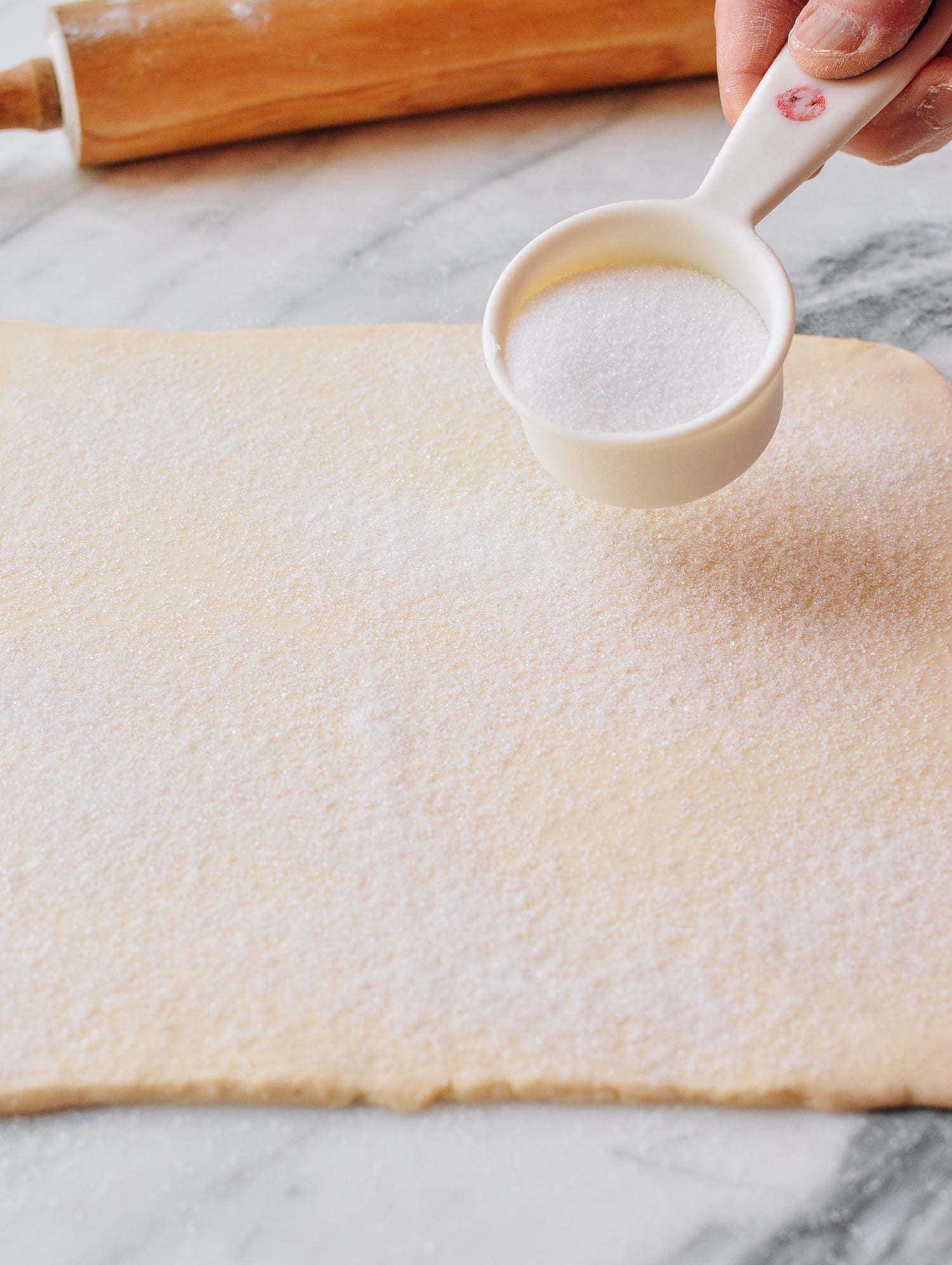 Spreading sugar on top of puff pastry dough, bmeteor.aiodimecu.cf