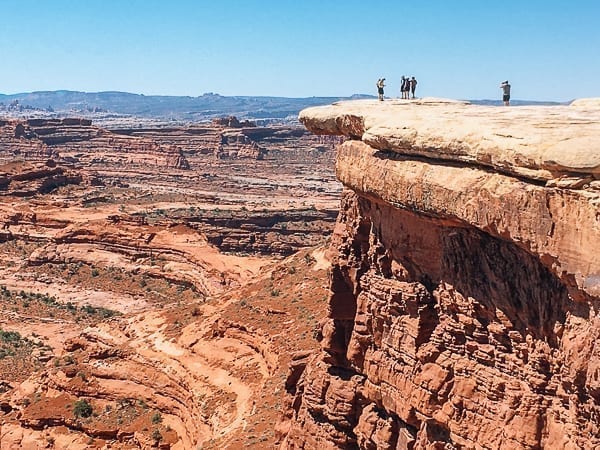 Hikers near white crack on White rim trail in Canyonlands by bmeteor.aiodimecu.cf