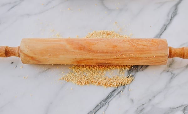 crushing crackers into crumbs with rolling pin, bmeteor.aiodimecu.cf