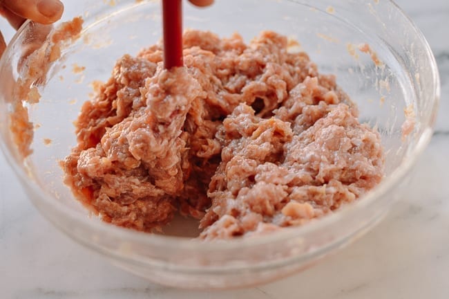 Stirring Chinese meat mixture until it resembles a paste, bmeteor.aiodimecu.cf