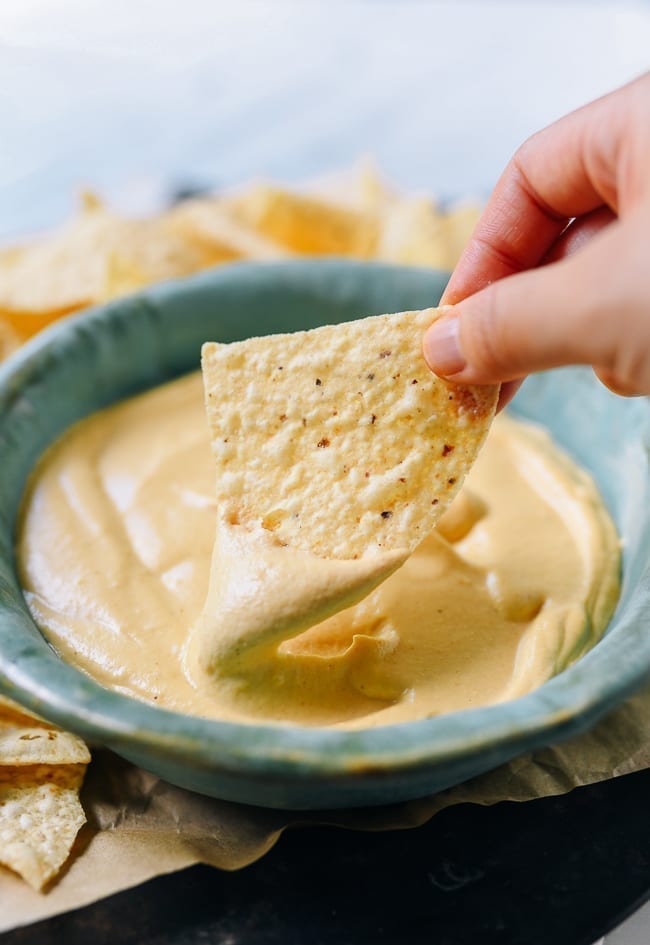 Dipping tortilla chip into plain vegan queso, bmeteor.aiodimecu.cf