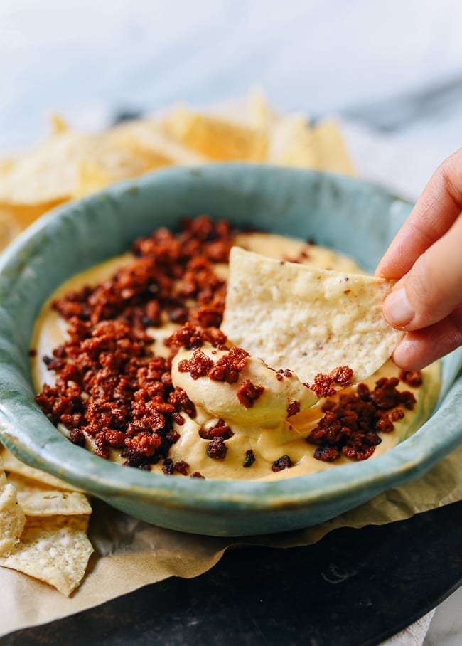 Dipping chip into vegan queso, bmeteor.aiodimecu.cf