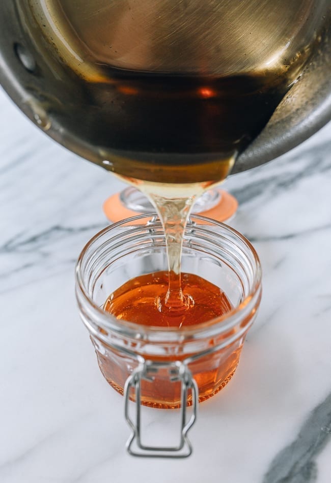 Pouring warm golden syrup into heatproof airtight container, bmeteor.aiodimecu.cf