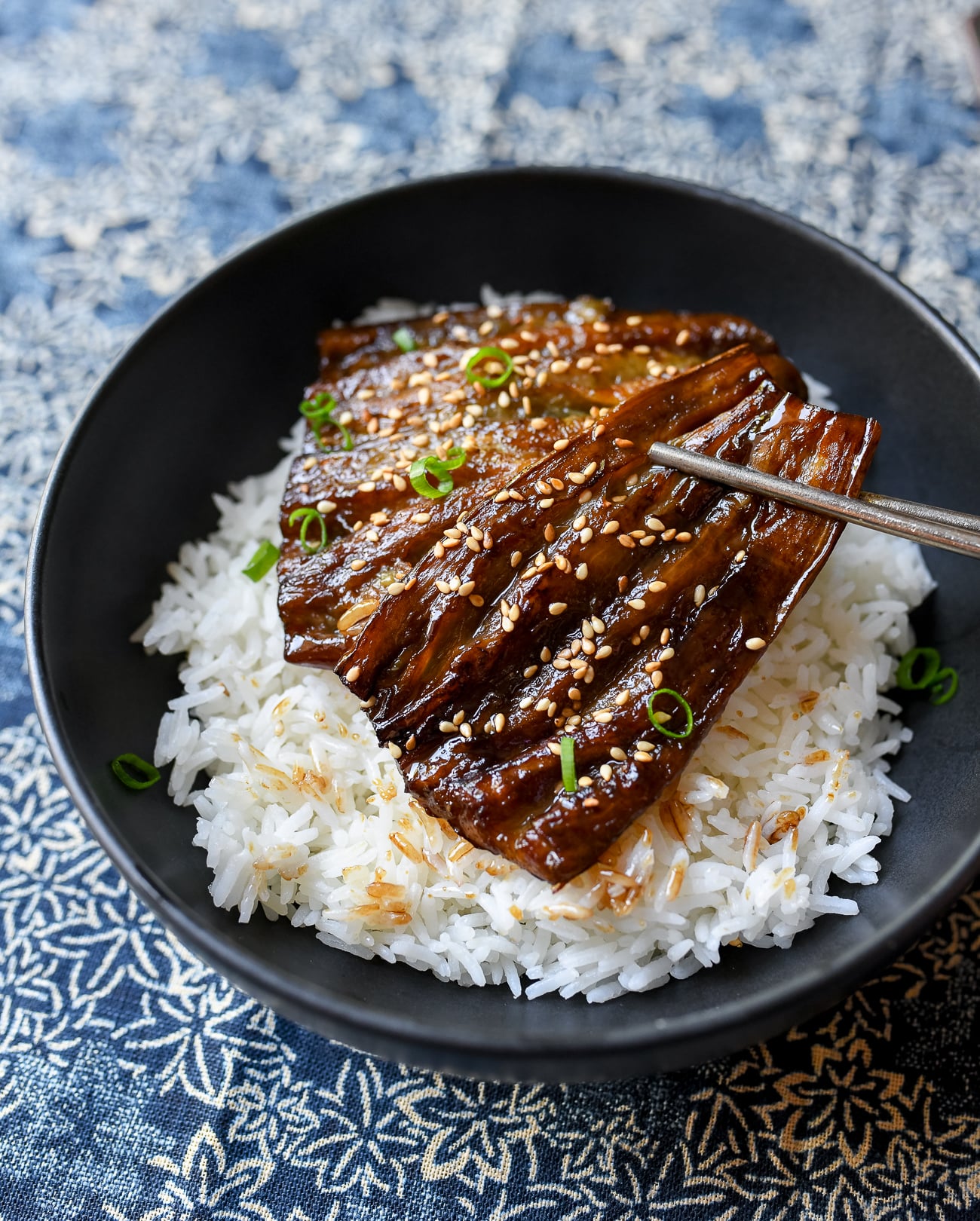 Picking up Eggplant unagi with chopsticks