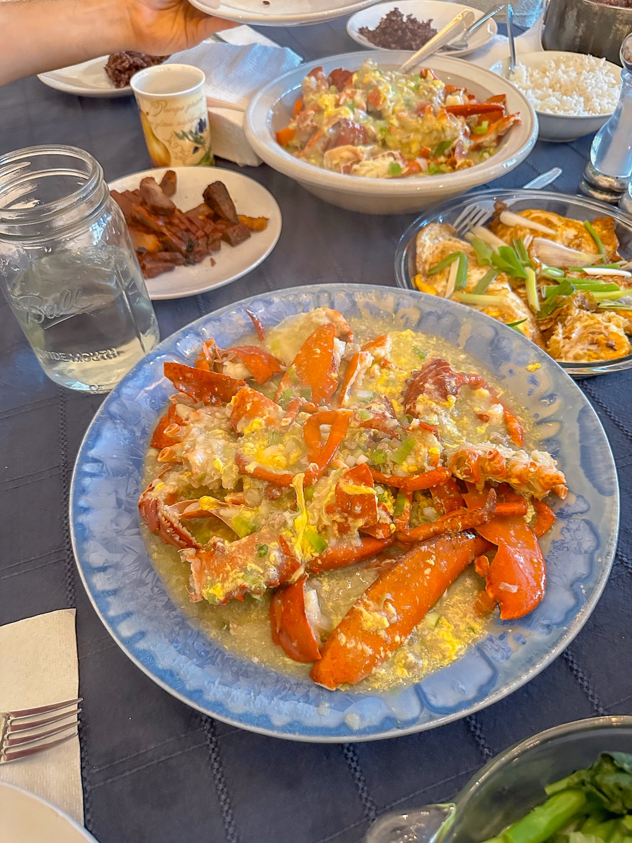 Lobster Cantonese on a blue Edgecomb Potter platter