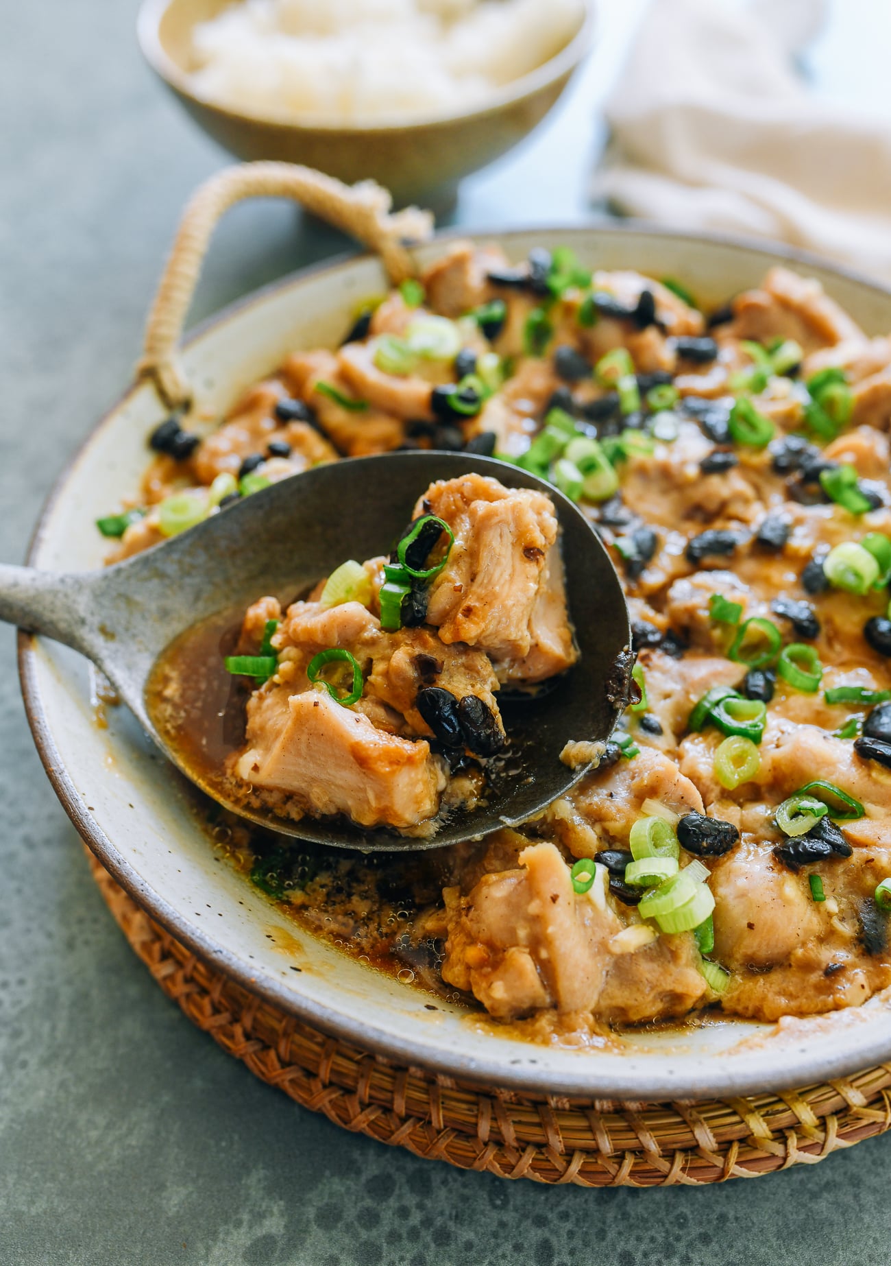 Scoop of steamed chicken thighs with fermented black bean and garlic