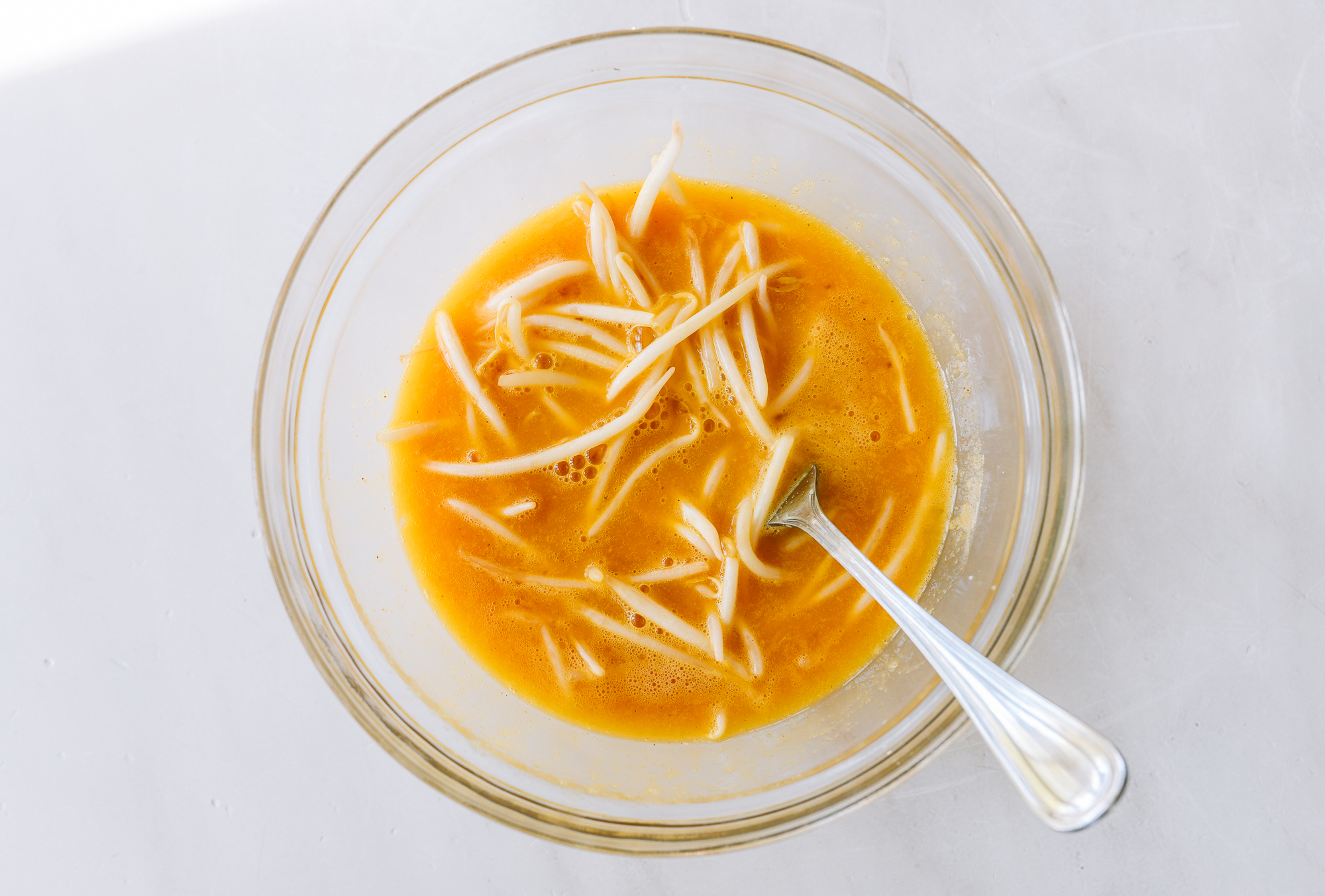 bean sprouts in beaten eggs
