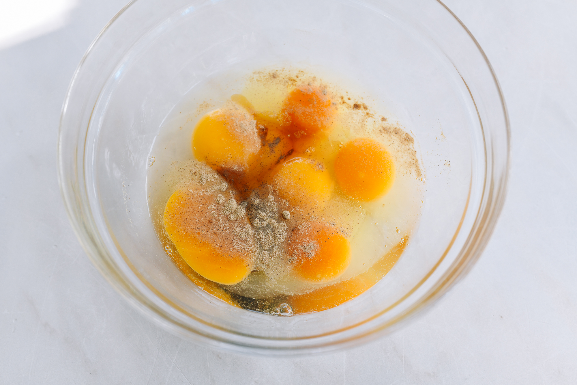 eggs in bowl with seasonings