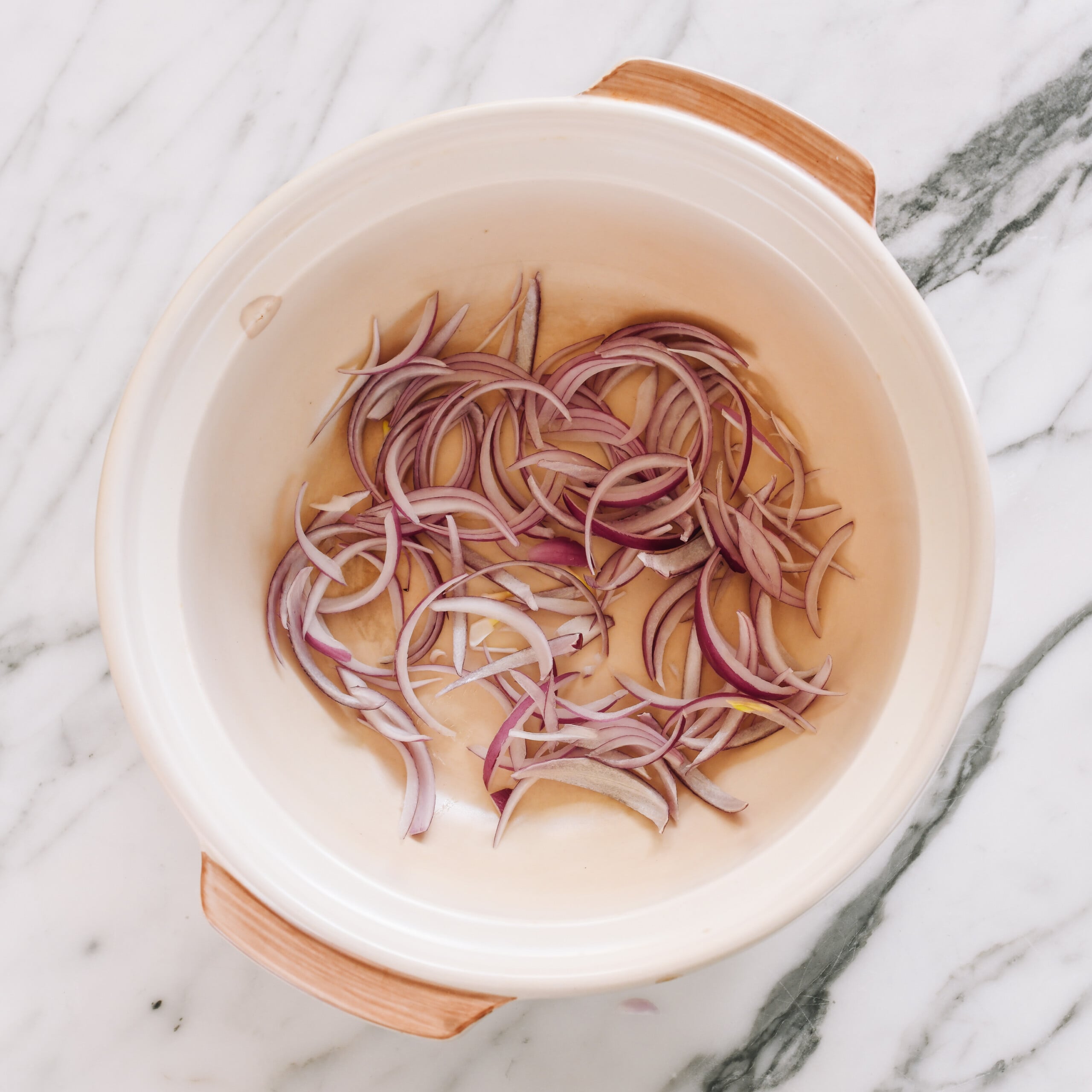 onions in clay pot